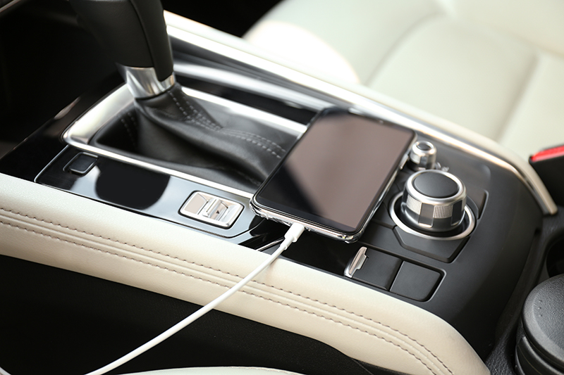 mobile phone with charging cable in car