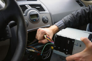 male-hands-remove-audio-system-from-car-dashboard-automobile-re