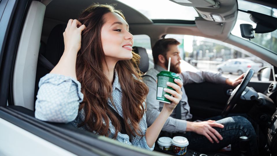 couple in car listening to car audio