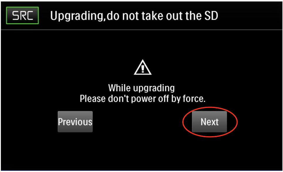 Firmware upgrading warning screen highlighting the Next button